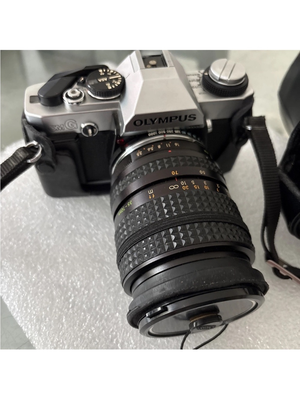 Olympus Silver and Black SLR Film Camera with Black Zoom Lens